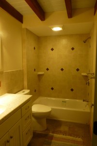 Ceramic tiled bathroom with heated floor.